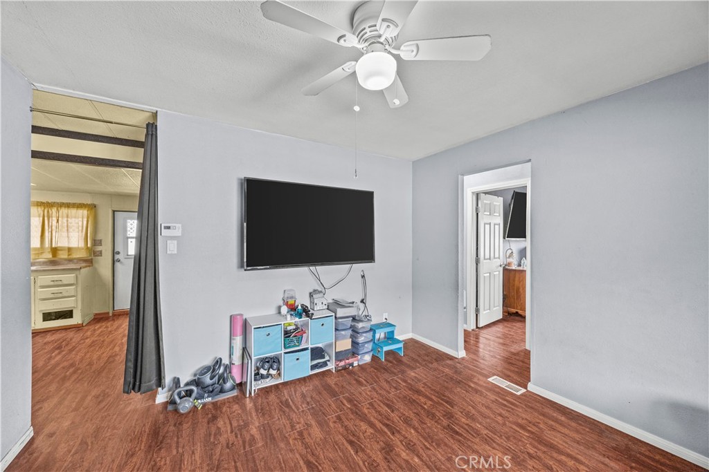 5700 Carbon Canyon Road, Unit 107 Brea, CA 92823 - Photo 20 of 27 a living room with furniture and a flat screen tv