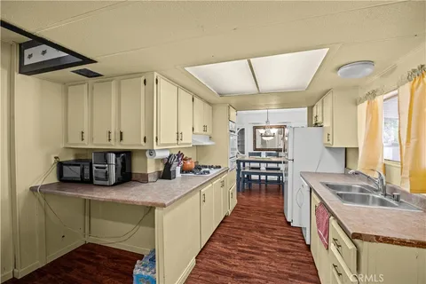 a kitchen with stainless steel appliances granite countertop a sink and cabinets
