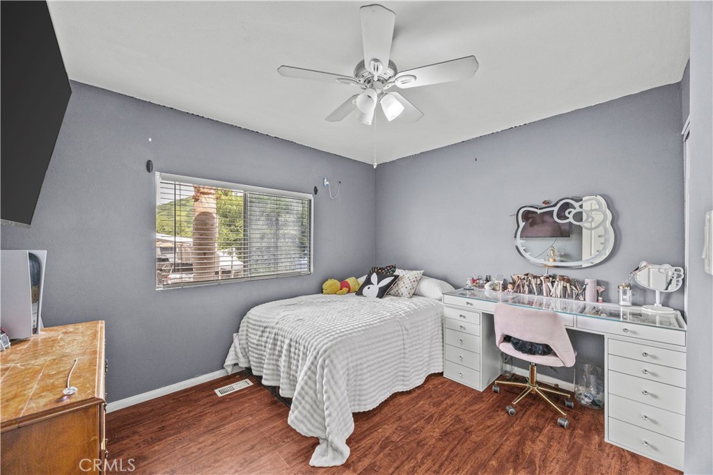 5700 Carbon Canyon Road, Unit 107 Brea, CA 92823 - Photo 21 of 27 a bedroom with a bed and a table in it