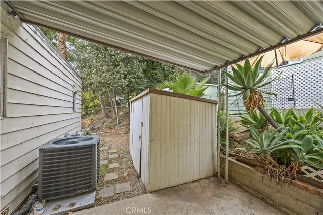 a view of a house with a tree