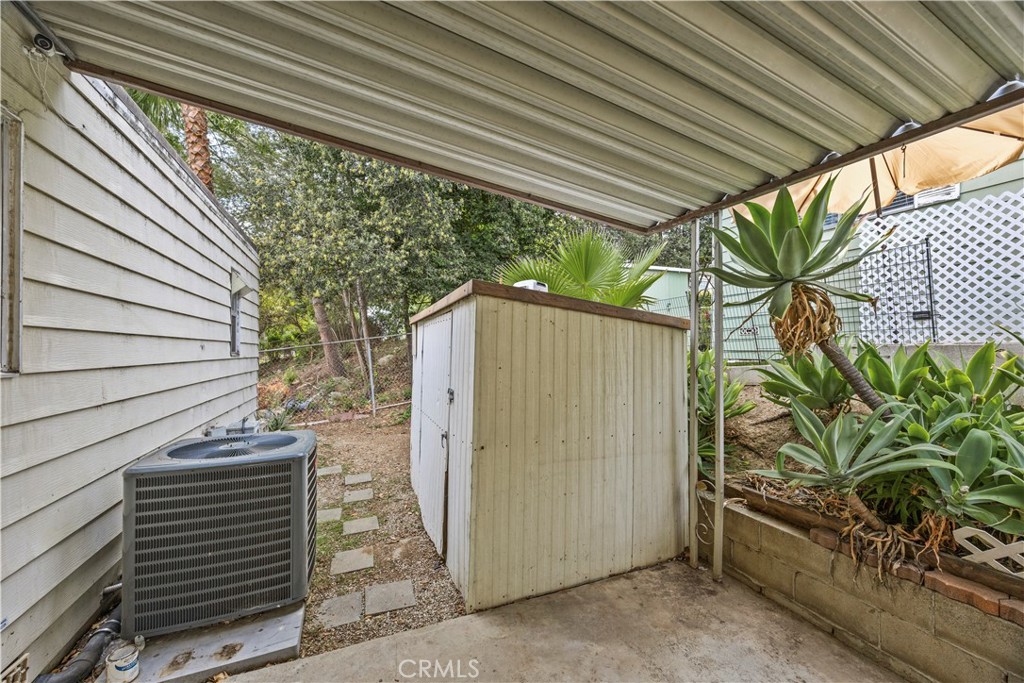 5700 Carbon Canyon Road, Unit 107 Brea, CA 92823 - Photo 26 of 27 a view of a house with a tree