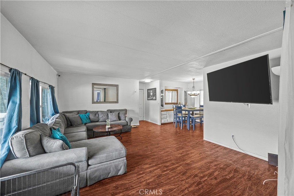 5700 Carbon Canyon Road, Unit 107 Brea, CA 92823 - Photo 7 of 27 a living room with furniture and a flat screen tv