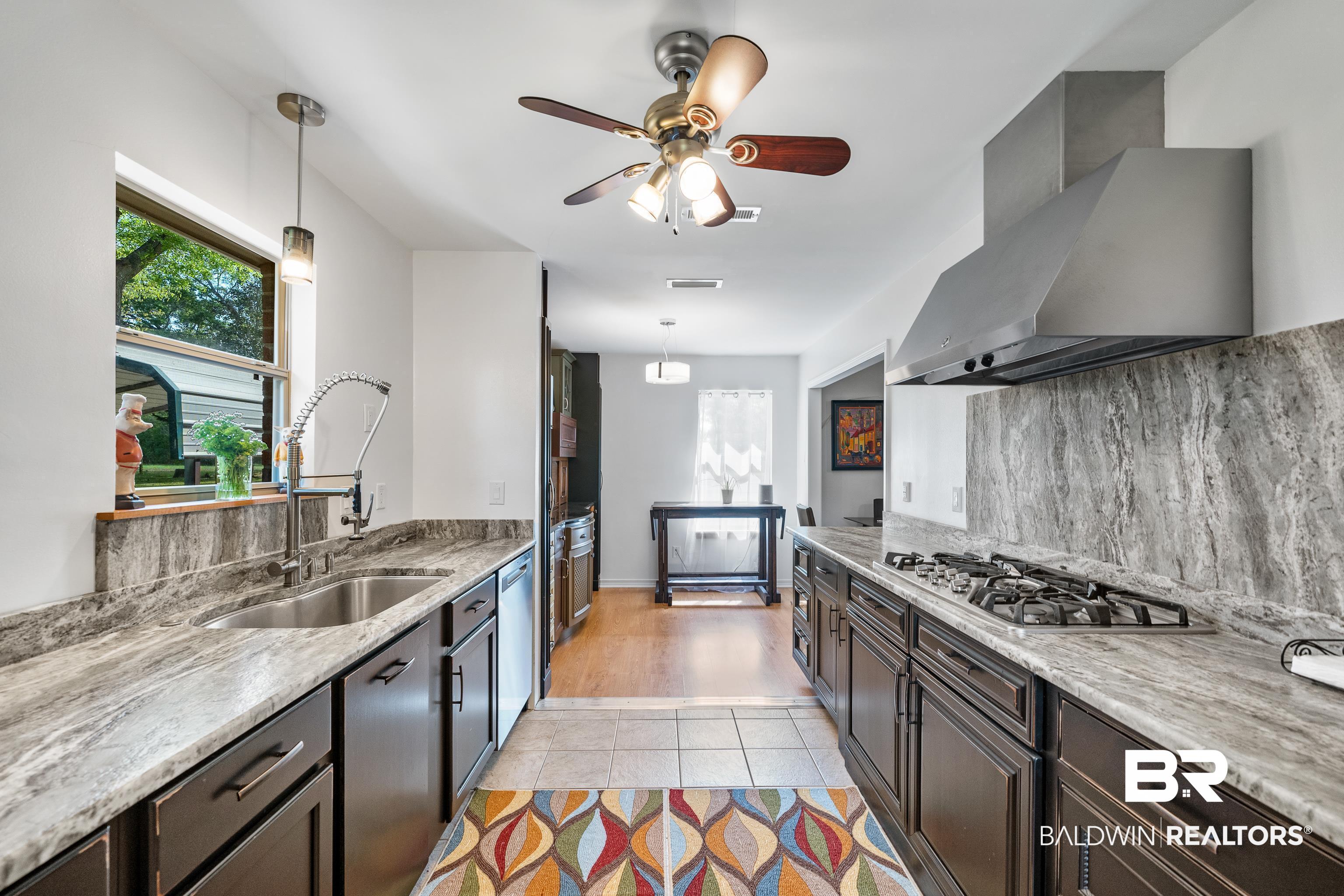 10407 LaLa Road Daphne, AL 36526 - Photo 13 of 47 Kitchen has Gas Cooktop and Granite Countertops