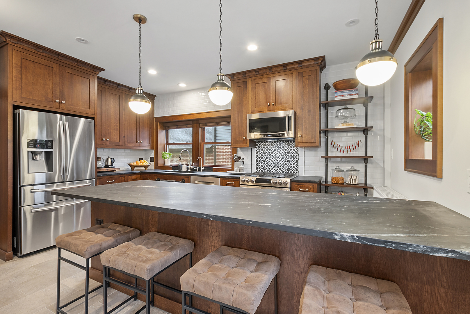 2138 West 109th Street Chicago, IL 60643 - Photo 12 of 33 a kitchen with counter top space cabinets and stainless steel appliances