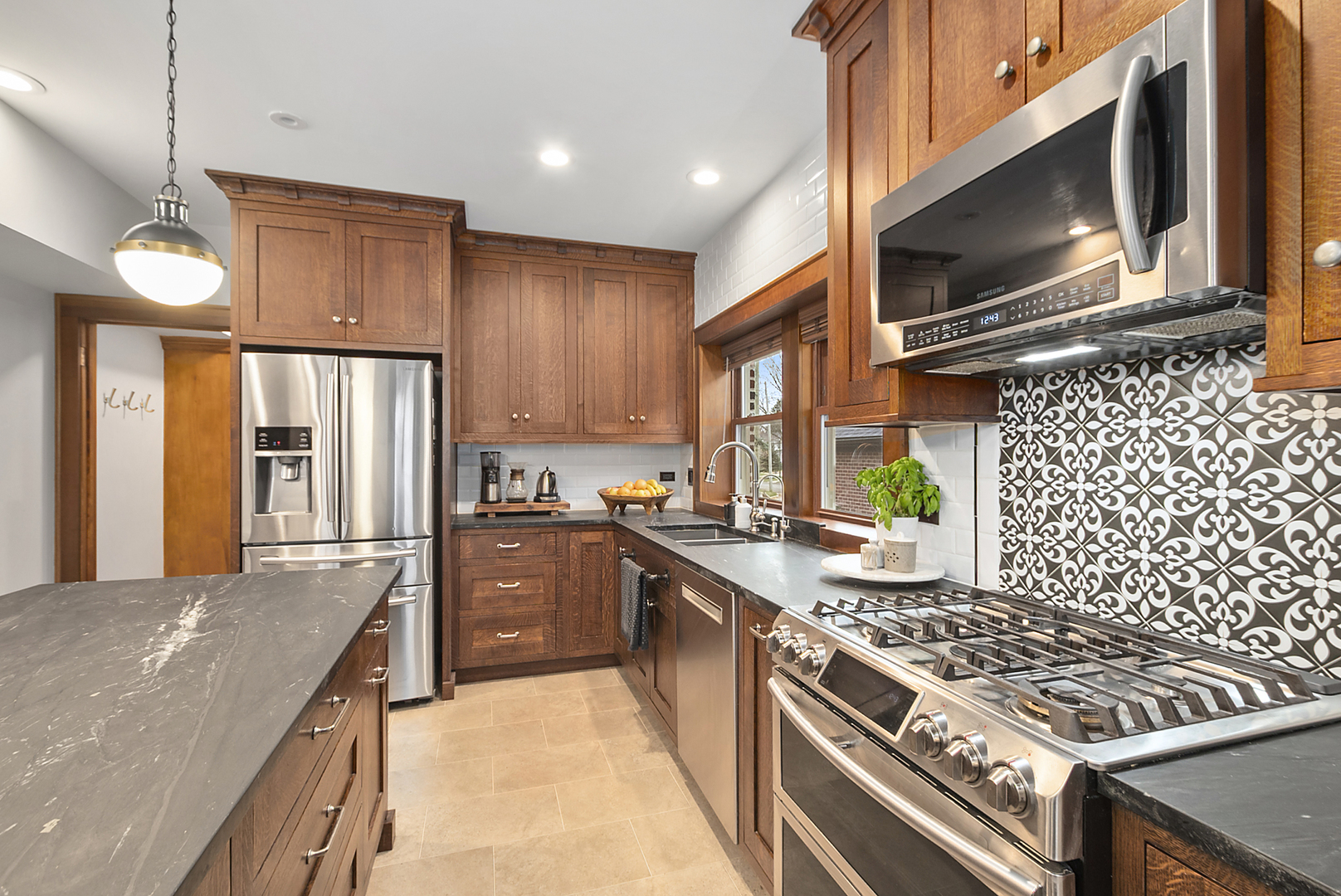 2138 West 109th Street Chicago, IL 60643 - Photo 14 of 33 a kitchen with stainless steel appliances granite countertop a stove top oven a sink dishwasher a refrigerator and a microwave