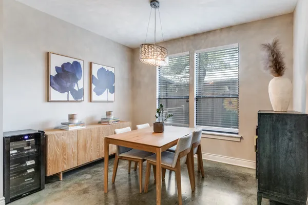 a kitchen with stainless steel appliances granite countertop a refrigerator a stove top oven a sink dishwasher and white cabinets