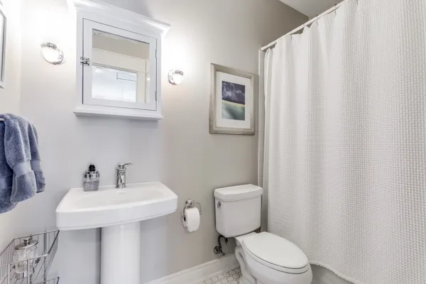 a bedroom with a large bed and a large window