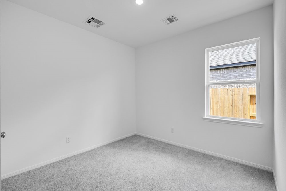 5606 Buttonbush Court Rosenberg, TX 77471 - Photo 16 of 34 an empty room with a window