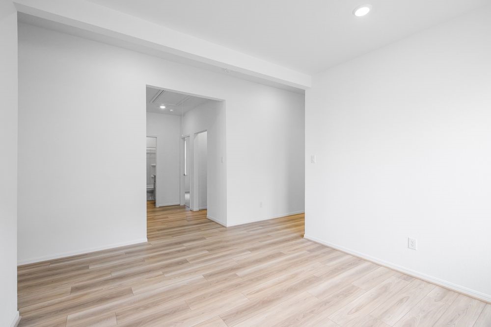 5606 Buttonbush Court Rosenberg, TX 77471 - Photo 19 of 34 a view of an empty room and wooden floor