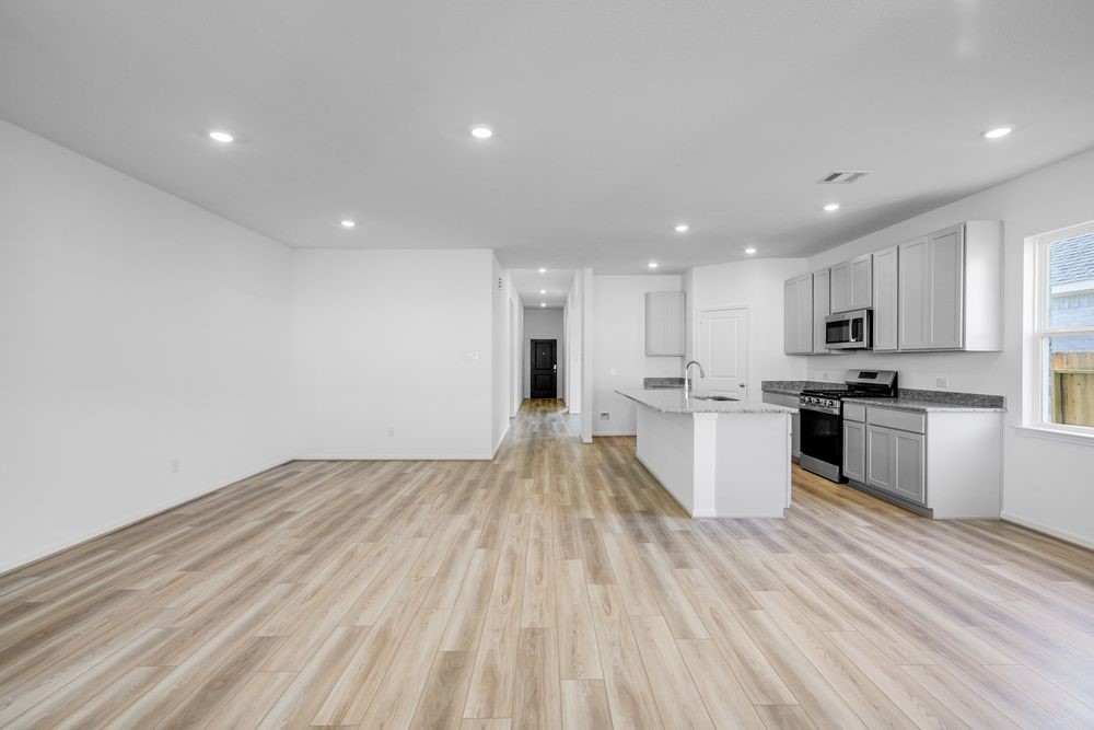5606 Buttonbush Court Rosenberg, TX 77471 - Photo 4 of 34 a view of kitchen with wooden floor and electronic appliances