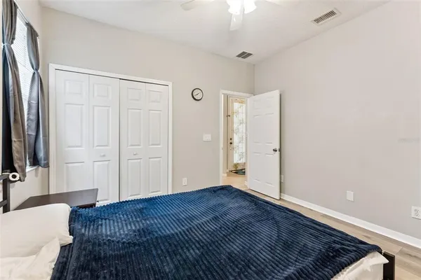 a bedroom with a bed and window