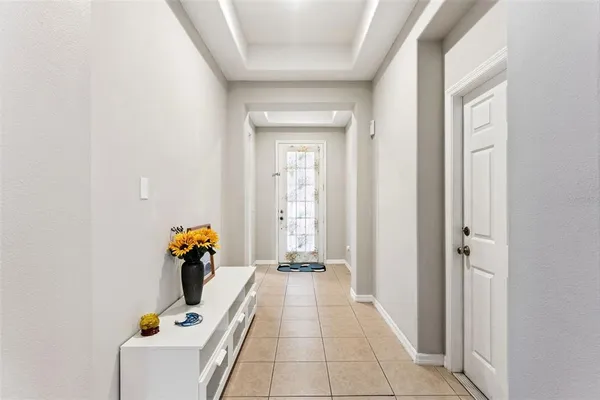 a view of room with furniture and clothes