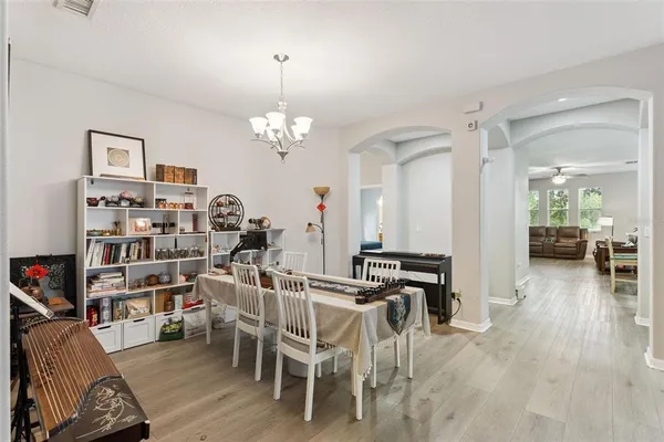 a view of a dining room with furniture window and outside view