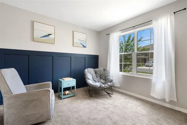 a living room with furniture and a window