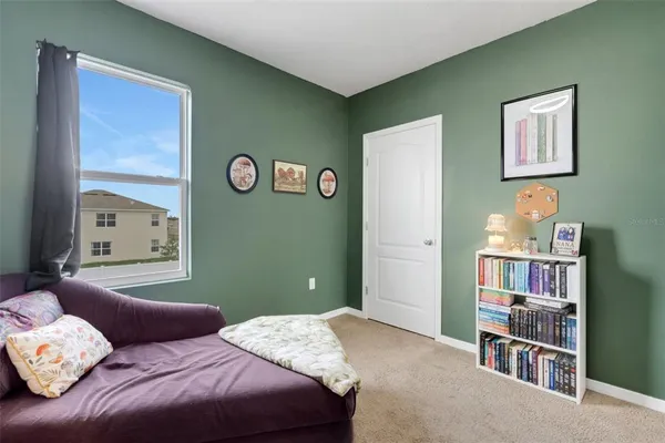 a bedroom with a bed and a cabinets
