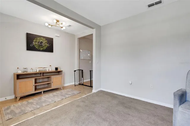 a view of a livingroom with washer and dryer