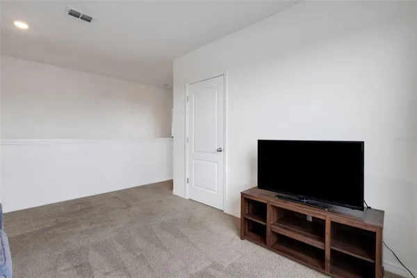 a flat screen tv on wall and a flat screen tv