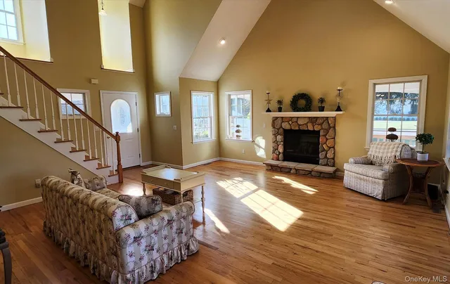 a kitchen with stainless steel appliances granite countertop a sink a stove and a refrigerator