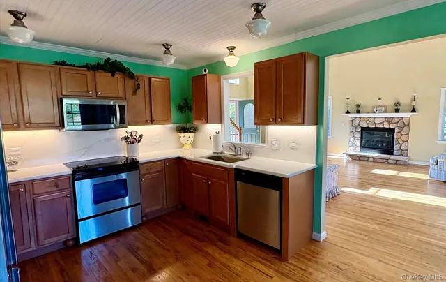 a kitchen with a refrigerator and a sink