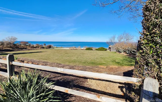 a view of swimming pool yard with an outdoor seating