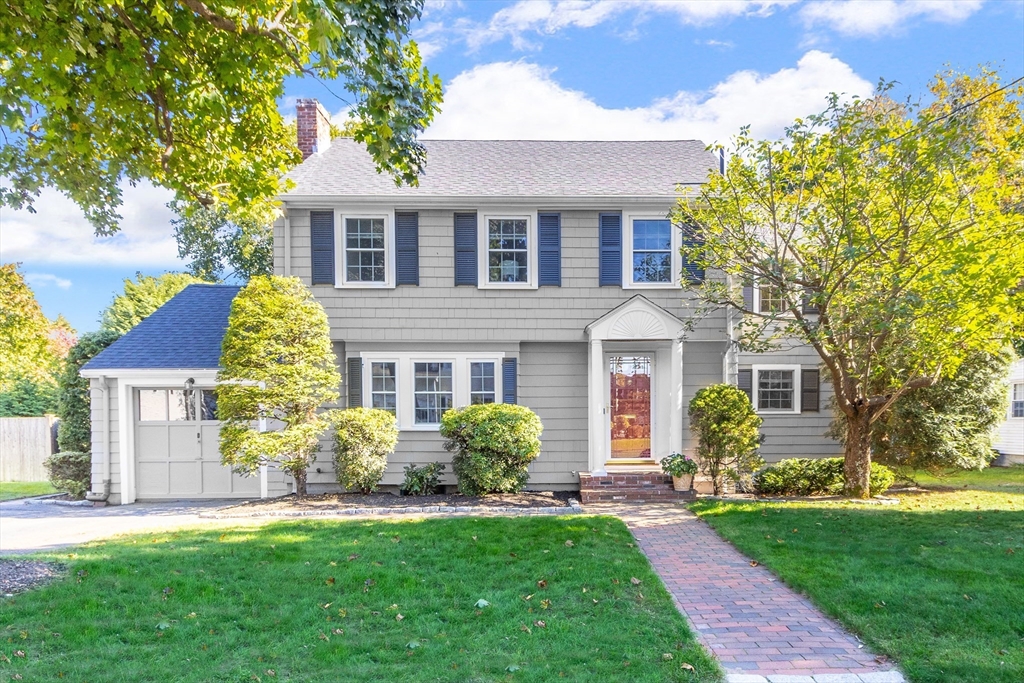 front view of a house next to a yard