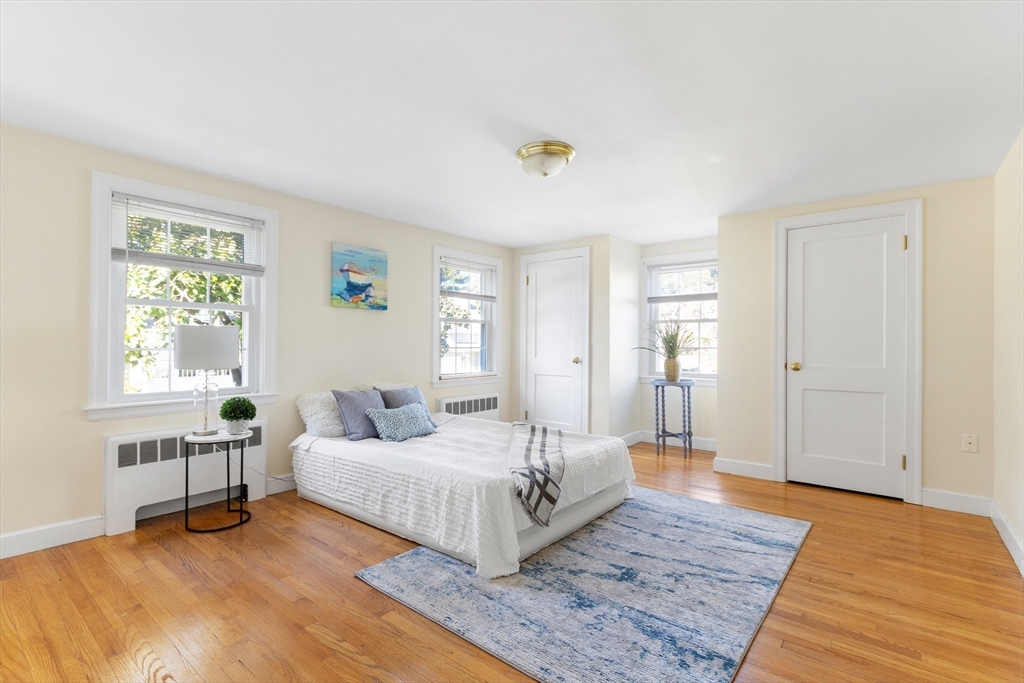 55 Berkshire Road Needham, MA 02492 - Photo 20 of 33 a bedroom with a bed and a table