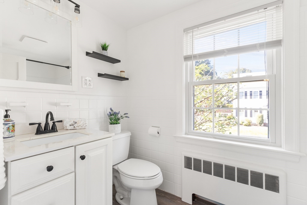 55 Berkshire Road Needham, MA 02492 - Photo 23 of 33 a bathroom with a sink and a mirror