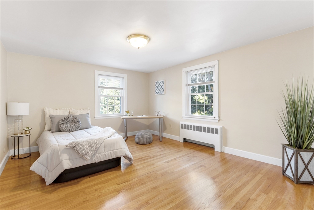 55 Berkshire Road Needham, MA 02492 - Photo 24 of 33 a bedroom with a bed and a window