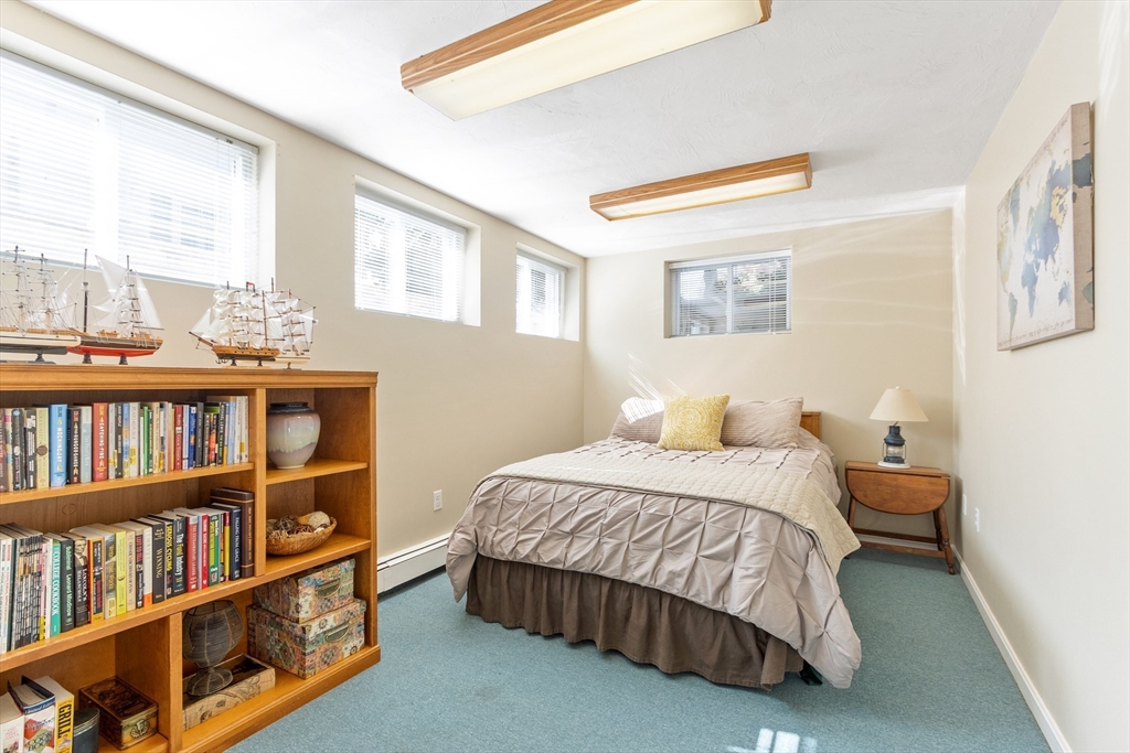 55 Berkshire Road Needham, MA 02492 - Photo 26 of 33 a bedroom with a bed furniture and a book shelf