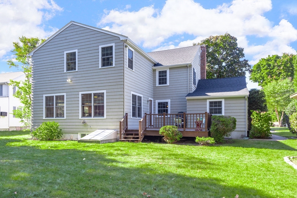 55 Berkshire Road Needham, MA 02492 - Photo 28 of 33 a front view of a house with a garden