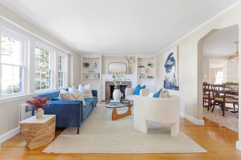 55 Berkshire Road Needham, MA 02492 - Photo 3 of 33 a living room with fireplace furniture and a wooden floor
