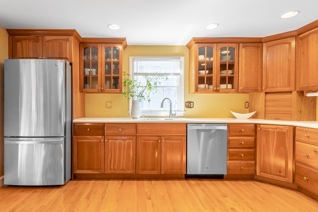 55 Berkshire Road Needham, MA 02492 - Photo 9 of 33 a kitchen with stainless steel appliances granite countertop a refrigerator and a sink