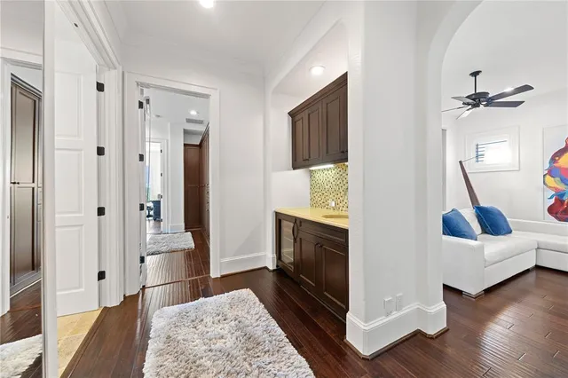 a view of walk in closet with clothes