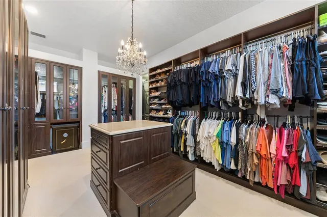 a spacious bathroom with a granite countertop sink mirror and shower