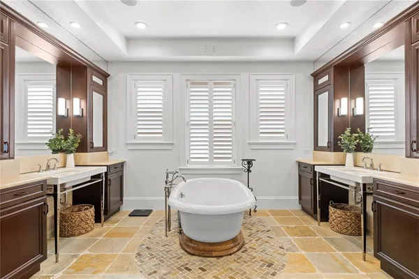 a view of a hallway with a bed and a window