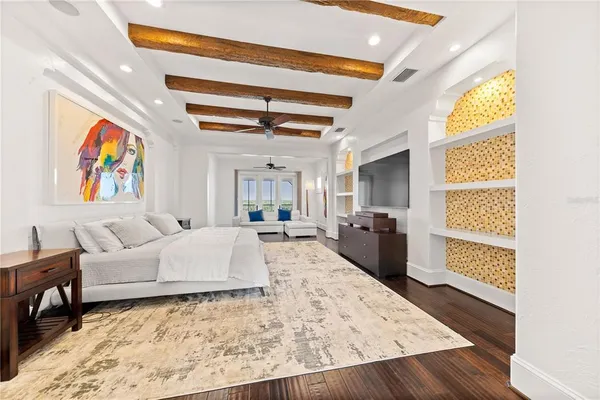 a living room with furniture and painting on the wall