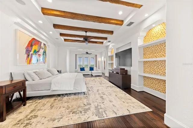 a living room with furniture and painting on the wall