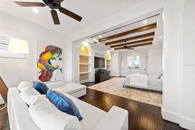 a bedroom with furniture and a large window