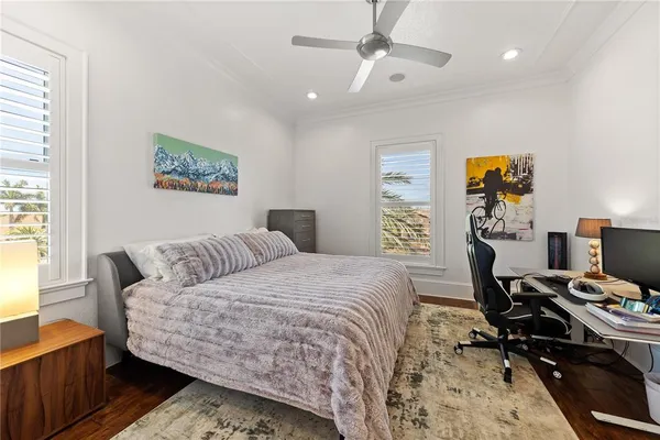a bathroom with a granite countertop sink a toilet and mirror