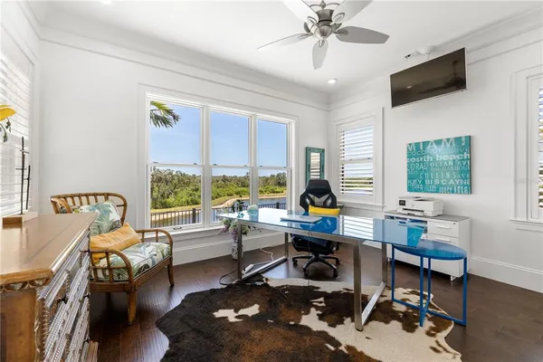 a bathroom with a granite countertop sink a mirror and vanity