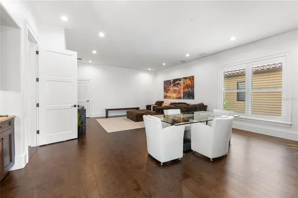 a kitchen with stainless steel appliances granite countertop counter space and wooden floors