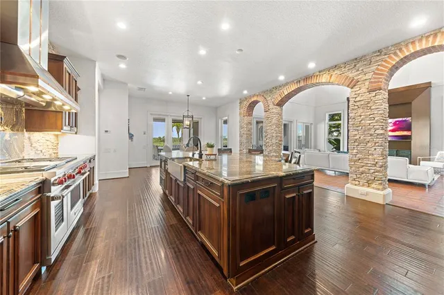 a view of kitchen dining table chairs and wooden floor