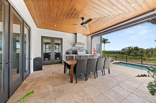 a dining room with furniture and a garden