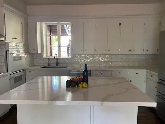 a bathroom with a sink and a window