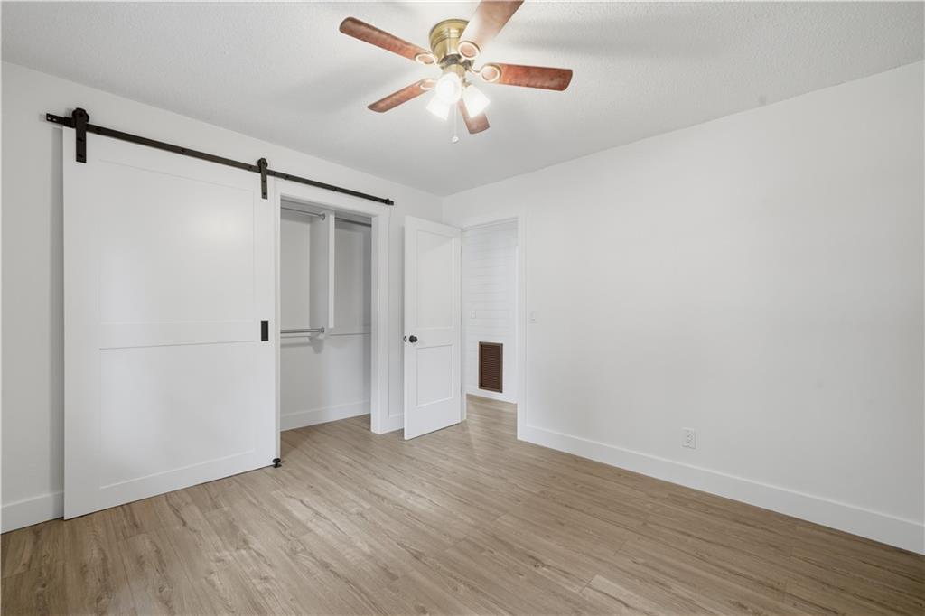 125 Childers Road Canton, GA 30115 - Photo 28 of 48 a view of an empty room and wooden floor