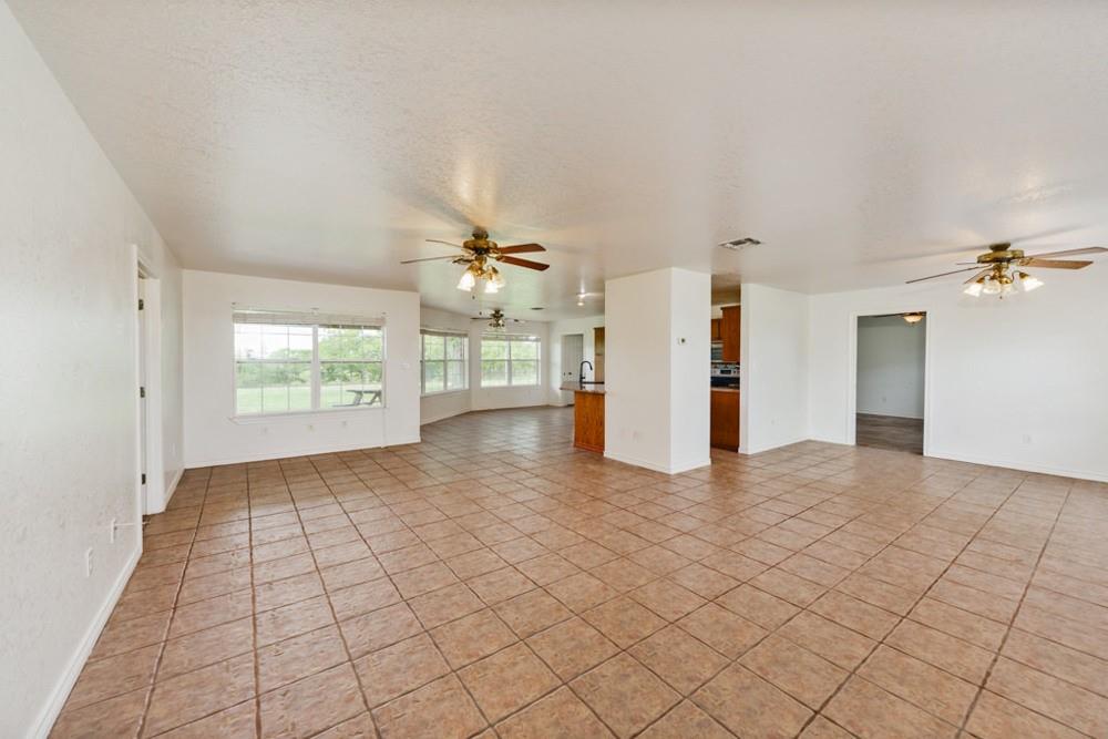 4316 Leona Road Bowie, TX 76230 - Photo 9 of 37 a view of a livingroom with a staircase