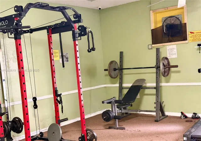 a bathroom with a shower and a glass door