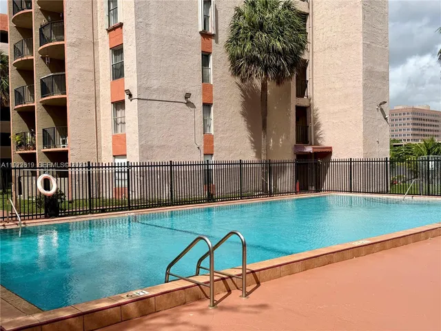 a view of swimming pool with a yard