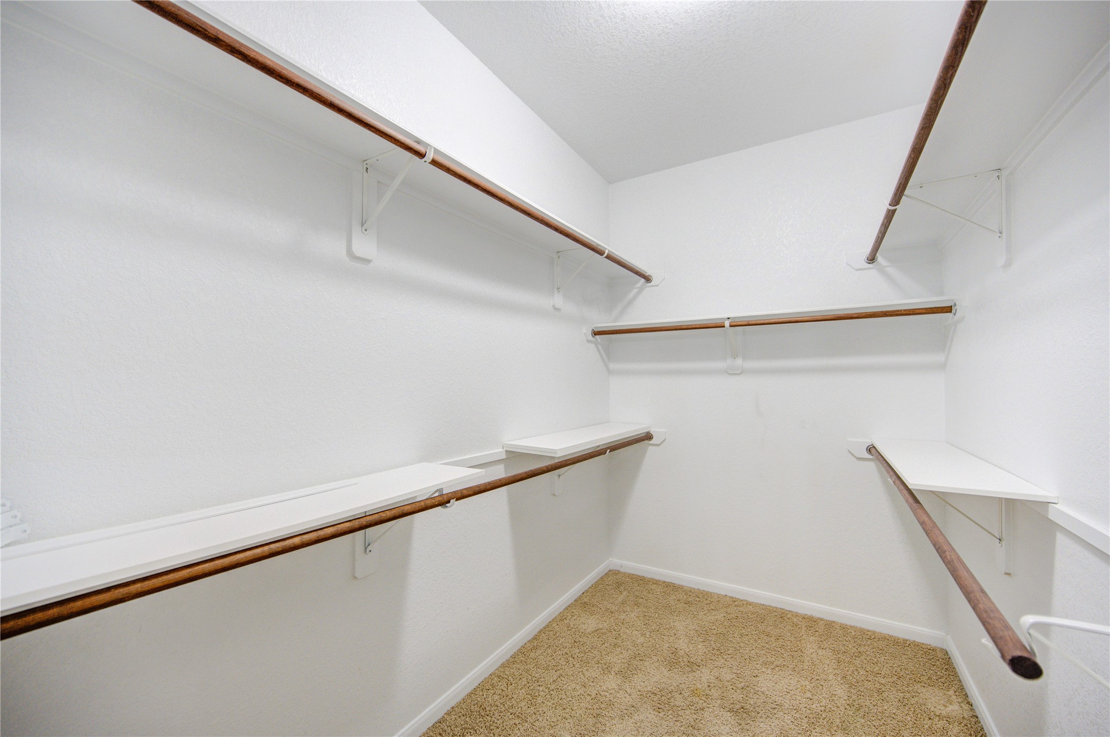 6014 Watford Bend Rosenberg, TX 77471 - Photo 9 of 18 12 – Oversized walk in closet with built in shelving and storage.
