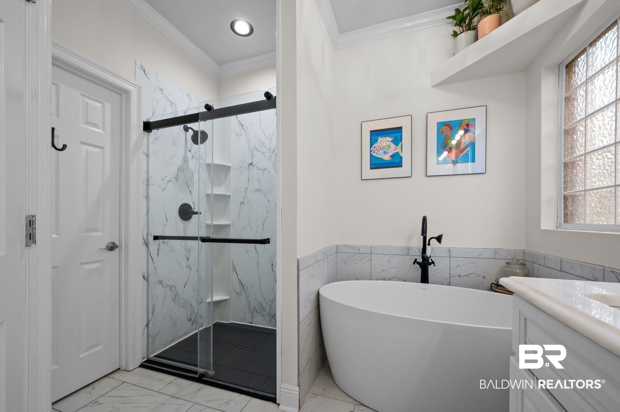 1825 Spring Hill Avenue Mobile, AL 36607 - Photo 20 of 43 Bathroom featuring vanity, light marble finish floors, a marble finish shower, a freestanding tub, and ornamental molding